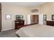 Spacious bedroom with large windows and a comfortable bed at 3507 N Snead Dr, Goodyear, AZ 85395