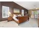 Main bedroom with plush carpet, wood furniture, and window shutters at 3507 N Snead Dr, Goodyear, AZ 85395