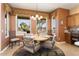 Bright dining area with large windows and seating for four at 3507 N Snead Dr, Goodyear, AZ 85395