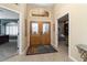 Bright entryway with double doors and views into adjacent rooms at 3507 N Snead Dr, Goodyear, AZ 85395