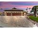 Three-car garage with decorative accents and a large driveway at 3507 N Snead Dr, Goodyear, AZ 85395