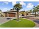 Three-car garage, stone facade, and landscaping at 3507 N Snead Dr, Goodyear, AZ 85395