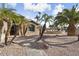 House exterior, walkway, landscaping, and palm trees at 3507 N Snead Dr, Goodyear, AZ 85395