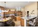 Open concept kitchen with island, breakfast bar, and ample cabinet space at 3507 N Snead Dr, Goodyear, AZ 85395