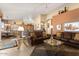 Open living room with a view into kitchen and access to backyard at 3507 N Snead Dr, Goodyear, AZ 85395