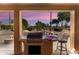 Enjoy cooking outdoors with this built-in grill and bar area at 3507 N Snead Dr, Goodyear, AZ 85395