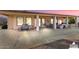 Outdoor kitchen and dining area on a large covered patio at 3507 N Snead Dr, Goodyear, AZ 85395