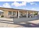 Covered patio with outdoor seating and a built-in grill at 3507 N Snead Dr, Goodyear, AZ 85395