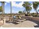 Spacious flagstone patio with lounge chairs and a serene view at 3507 N Snead Dr, Goodyear, AZ 85395
