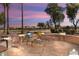 Spacious flagstone patio with lounge chairs, perfect for outdoor entertaining at 3507 N Snead Dr, Goodyear, AZ 85395