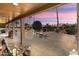 Relaxing patio with seating area and built-in grill, overlooking a desert landscape at 3507 N Snead Dr, Goodyear, AZ 85395