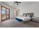 Main bedroom with plush bed and sliding doors to patio at 4723 E Foothill Dr, Paradise Valley, AZ 85253