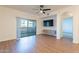 Living room with wood floors, ceiling fan, and built-in media console at 920 E Devonshire Ave # 2019, Phoenix, AZ 85014