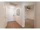 Light and bright entryway with wood-look flooring, leading to bedroom at 920 E Devonshire Ave # 2019, Phoenix, AZ 85014