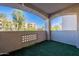 Private patio with artificial turf and string lights at 920 E Devonshire Ave # 2019, Phoenix, AZ 85014