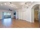Spacious living room with wood floors, ceiling fan, and access to patio at 920 E Devonshire Ave # 2019, Phoenix, AZ 85014