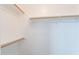 Walk-in closet with wood shelving and hanging rods at 920 E Devonshire Ave # 2019, Phoenix, AZ 85014