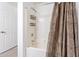 Clean bathroom with shower/tub combo and neutral tile at 920 E Devonshire Ave # 2019, Phoenix, AZ 85014