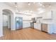 Modern kitchen with white cabinets, stainless steel appliances, and wood floors at 920 E Devonshire Ave # 2019, Phoenix, AZ 85014
