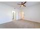 Bedroom with carpet, ceiling fan, and mirrored closet doors at 920 E Devonshire Ave # 2019, Phoenix, AZ 85014