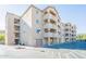 Three-story apartment building with balconies and parking in front at 920 E Devonshire Ave # 2019, Phoenix, AZ 85014