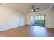 Bright bedroom with wood floors, ceiling fan and sliding door to patio at 920 E Devonshire Ave # 2019, Phoenix, AZ 85014