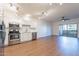 Modern kitchen with white cabinets, stainless steel appliances, and wood floors at 920 E Devonshire Ave # 2019, Phoenix, AZ 85014