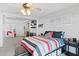 Main bedroom with queen bed, ceiling fan, and access to living room at 1506 E Oregon Ave, Phoenix, AZ 85014