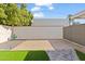 Side yard with gravel and a pathway leading to the back at 1506 E Oregon Ave, Phoenix, AZ 85014