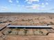 Aerial view of covered cattle pens and large property at 32614 N 227Th Ave, Wittmann, AZ 85361