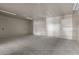 Spacious, empty garage with concrete floor and high ceilings at 32614 N 227Th Ave, Wittmann, AZ 85361