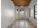 Bright dining room with large windows, tile floors, and a chandelier at 32614 N 227Th Ave, Wittmann, AZ 85361