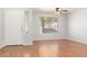 Living room with hardwood floors and a ceiling fan at 16019 W Moreland St, Goodyear, AZ 85338