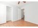 Bedroom featuring wood flooring and a large closet at 16019 W Moreland St, Goodyear, AZ 85338