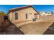 Backyard of the house showing a large yard with block wall at 16019 W Moreland St, Goodyear, AZ 85338