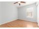 Bedroom with ceiling fan and wood-look flooring at 16019 W Moreland St, Goodyear, AZ 85338