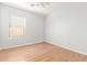 Bright bedroom with light wood flooring and window coverings at 16019 W Moreland St, Goodyear, AZ 85338