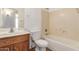 Bathroom with shower/tub combo and wood vanity at 16019 W Moreland St, Goodyear, AZ 85338