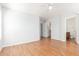 Bedroom with wood flooring and access to bathroom at 16019 W Moreland St, Goodyear, AZ 85338
