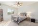 Bedroom with metal bed frame and window at 26984 W Yukon Dr, Buckeye, AZ 85396