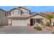 Two-story house with beige exterior, solar panels, and landscaped yard at 20722 N 38Th St, Phoenix, AZ 85050