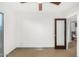 Bright bedroom with sliding door, ceiling fan, and built-in closet at 3033 E Sierra St, Phoenix, AZ 85028