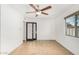 Well-lit bedroom featuring a ceiling fan and window at 3033 E Sierra St, Phoenix, AZ 85028