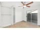 Bright bedroom with sliding door, ceiling fan, and built-in closet at 3033 E Sierra St, Phoenix, AZ 85028