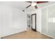 Bright bedroom with door to bathroom, ceiling fan and built-in closet at 3033 E Sierra St, Phoenix, AZ 85028