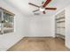 Simple bedroom with a ceiling fan and large window at 3033 E Sierra St, Phoenix, AZ 85028