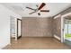 Bright bedroom with built-in shelving and concrete floors at 3033 E Sierra St, Phoenix, AZ 85028