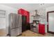 Modern kitchen with stainless steel appliances and red cabinets at 3033 E Sierra St, Phoenix, AZ 85028