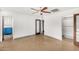 Bright bedroom with ceiling fan and access to a pool view at 3033 E Sierra St, Phoenix, AZ 85028
