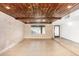 Spacious living room with exposed brick and wood ceiling at 3033 E Sierra St, Phoenix, AZ 85028
